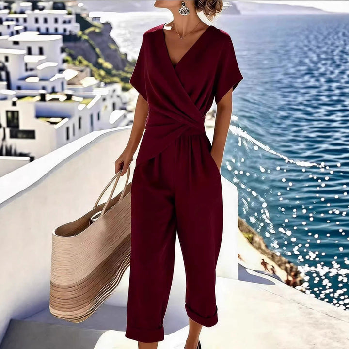 Damen Eleganter Jumpsuit mit Wickeloptik und breiten Beinen